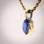 Erosion lab sapphire and 10k gold pendant