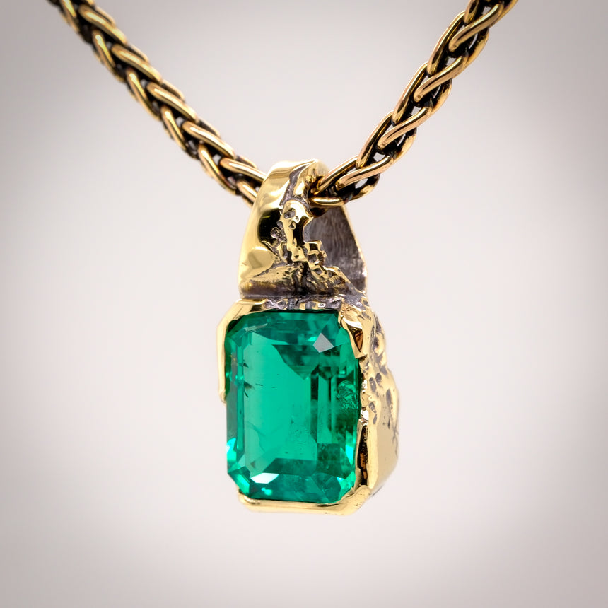 ‘Erosion’ lab emerald 10k gold pendant