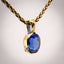 Erosion lab sapphire and 10k gold pendant