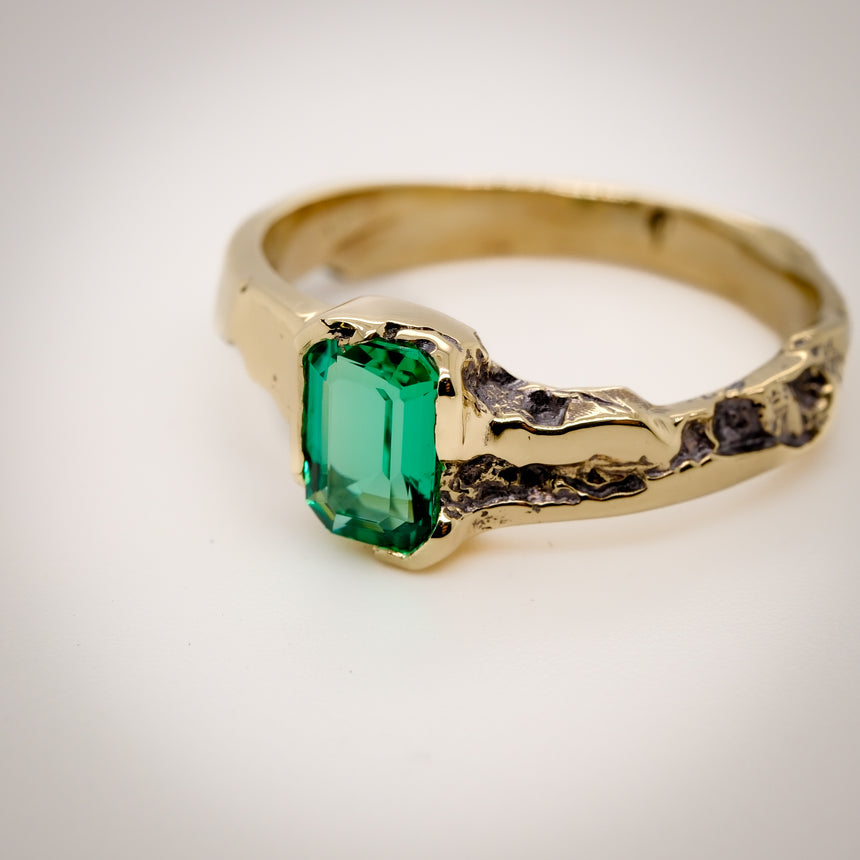 ‘Erosion’ lab emerald and 10k gold ring