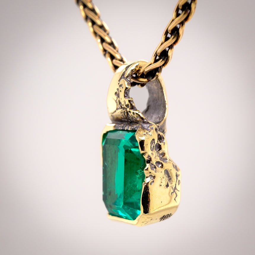 ‘Erosion’ lab emerald 10k gold pendant