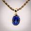 Erosion lab sapphire and 10k gold pendant