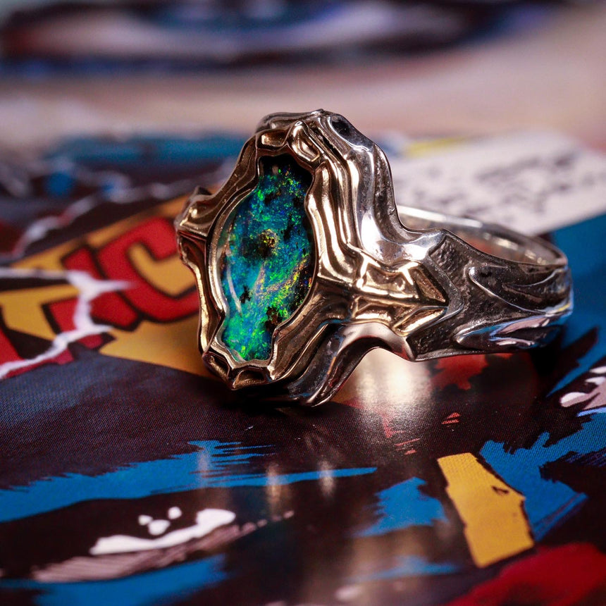 Dark Galaxy boulder opal ‘Earthset’ ring