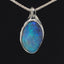 Deep blue boulder opal & white gold pendant