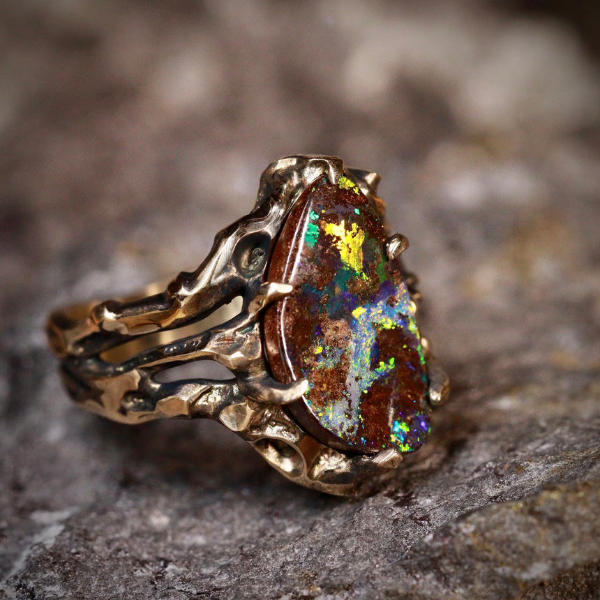 Koroit matrix opal in dark gold ring