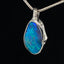 Deep blue boulder opal & white gold pendant